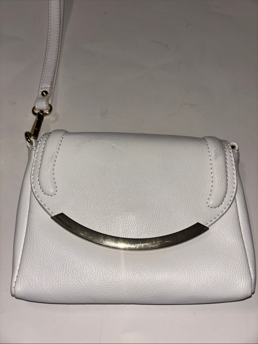 Sleek White Crossbody Bag with Gold Accent